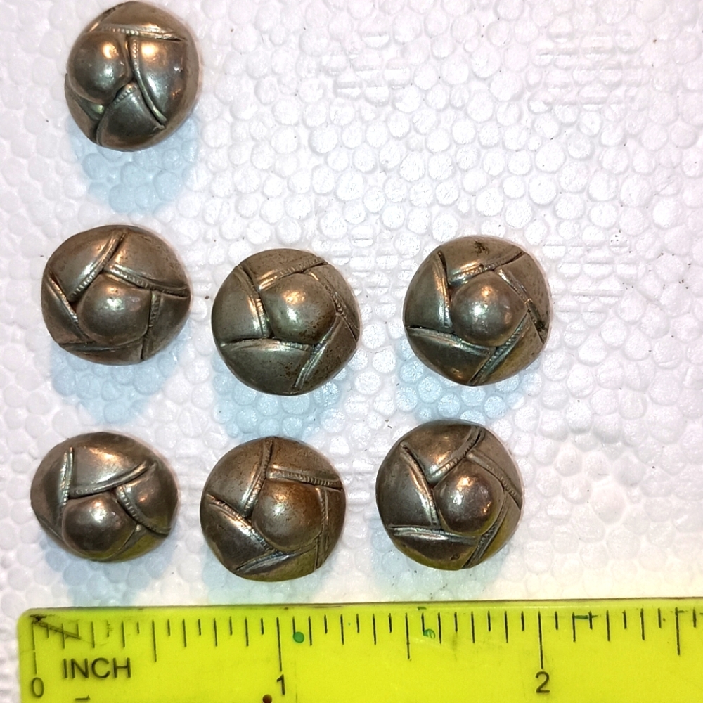 Lot of 7 vintage silver colored metal buttons.